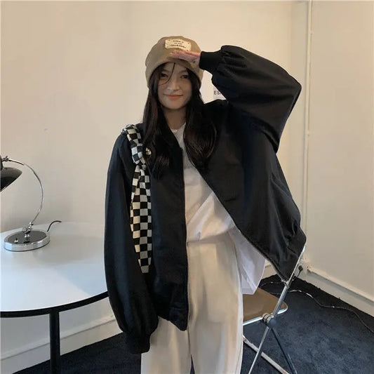 Model wearing the black Urban Oversized Bomber Jacket